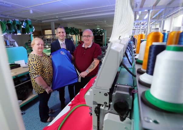Paul Reid (centre), business development manager at Ulster Bank, pictured at the new C&G Embroidery premises with Carol and Gary Winter.