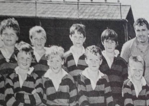 The mini rugby team from Ballymena Academy who competed in the Northern Bank Primary  Mini-Rugby Championships at Ravenhill pictured with coach Barry Coen and Northern Bank Youth Officer, Brian McKibbin.
1989