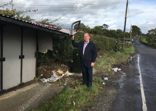 DUP MLA William Irwin at a bus shelter on the Red Lion Rd junction near Portadown after a crash at the weekend