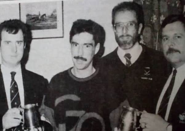 Dave 'Boy' McAuley presents tankards to Leslie King and John McCalmont in recognition of 25 years' service to Larne Men's Hockey Club as Ronnie Blair and Bill Young look on.
1989