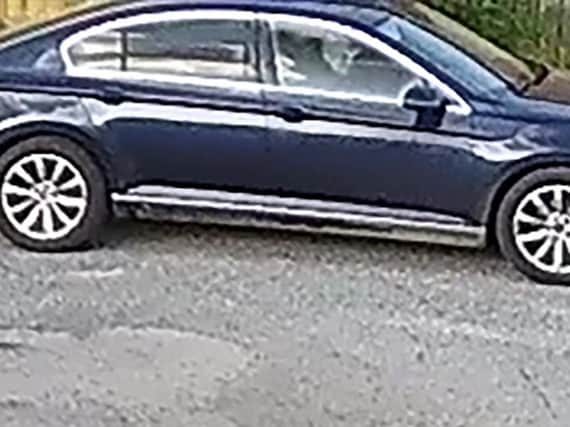 This image shows a man who appears to be wearing a baseball cap, as he drives into Dewarts Garage shortly before the murder of Lurgan man Malcolm McKeown at around 7.19pm.