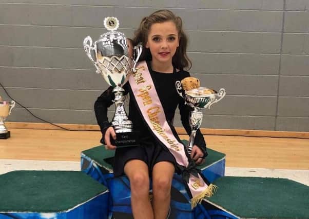 Eight-year-old Molly Keys from Doagh who recently competed at the Kent dance championships and won the Kent Open trophy for the age eight category. Photo kindly submitted