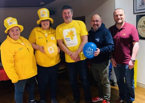 From left - Representatives from Marie Curie; Steve Whyte, Bridge Bar manager; Adrian Friel of Causeway branch of Alzheimers Society, Daren McColgan Chairman of Portstewart MUSC