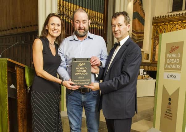 John Agnew, Ann's Pantry, Larne, is presented with his award by Claire Andrew of Andrew Ingredients at the event hosted by Stephen Hallam, Master Baker, managing director of Dickinson & Morris and chair of the judges.