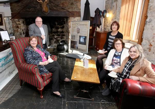 The Mayor of Mid and East Antrim, Cllr Maureen Morrow, Samuel Wilson, consultant, Kirsty Fallis, owner Dobbins Inn, Angela Lavin, senior investment manager, National Lottery Heritage Fund and Cllr Cheryl Johnston, chair of THI Project Board.