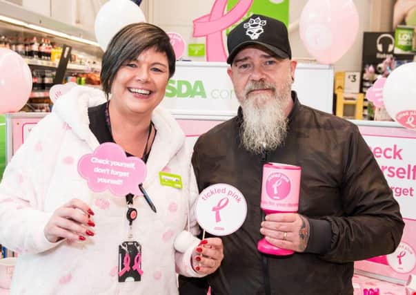 Customer Paul Whiteside joins Catherine McCallion, Asda Larne Community Champion, for Tickled Pink activity in aid of charity.