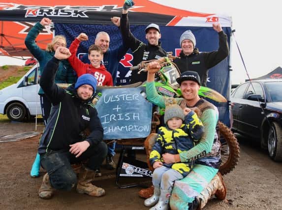 John Meara and team celebrate doing the MX1 double in 2019
