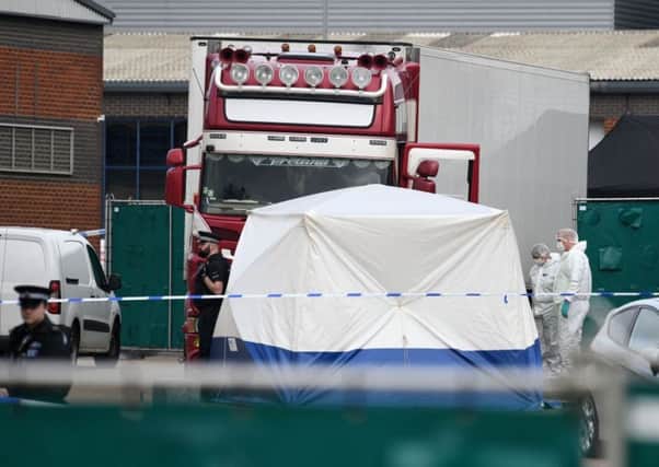THURROCK, ENGLAND - OCTOBER 23: Police and forensic officers investigate the site where 39 bodies were discovered in the back of a lorry on October 23, 2019 in Thurrock, England. The lorry was discovered early Wednesday morning in Waterglade Industrial Park on Eastern Avenue in the town of Grays. Authorities said they believed the lorry originated in Bulgaria and entered the country at Holyhead on October 19. The suspected driver was arrested in connection with the investigation. (Photo by Leon Neal/Getty Images)
