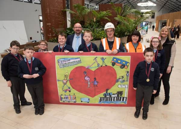 P6 pupils from Ardnashee School during their visit to the North-West Transport Hub; they are joined by (l-r) Mark Montgomery, Assistant Route Manager, Translink NI Railways; Darren McIvor, Site Manager, Farrans; Lisa McFadden, North-West Transport Hub Project Manager, Translink; and Nicola Laight, Farrans.