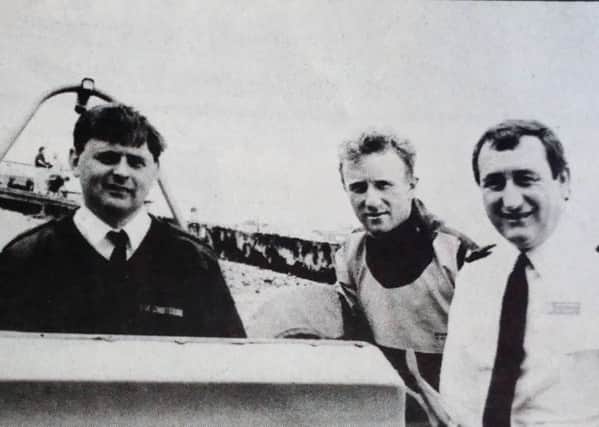 Coastguard Bill Bennett with members of the Larne Coastguard who took part in a rescue off The Maidens - Martin Agnew and Drew Girvan with auxiliary Jim Bearns. 1992