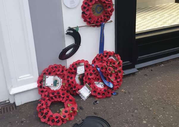 Wreaths laid in memory of six soldiers killed in a bomb attack in Lisburn have been vandalised