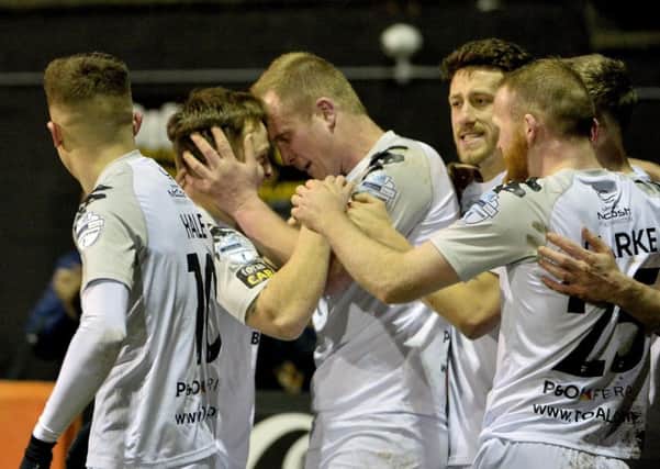 Jordan Owens (centre) celebrates his goal in Crusaders' victory over Carrick Rangers. Pic by INPHO.