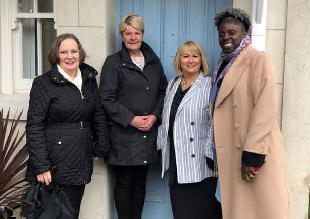 Joy Scott, Group Chair at Clanmil, Carol Mc Taggart, Clanmil Group Director of Development and Siobhan Brown, Clanmil Construction and Defects Manager welcome Karen Mc Laughlin to her new home