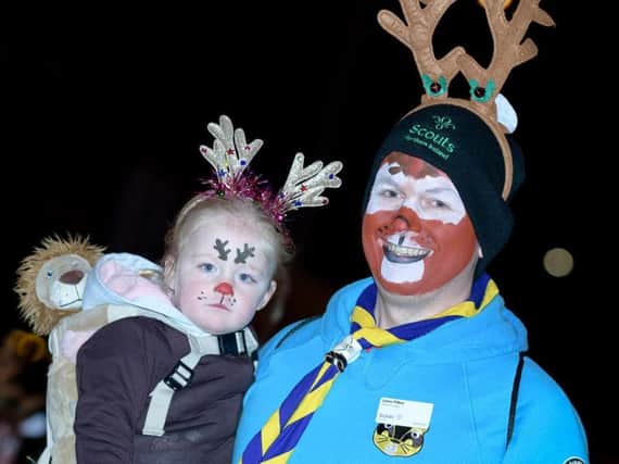 Faces painted in festive style on Friday evening.