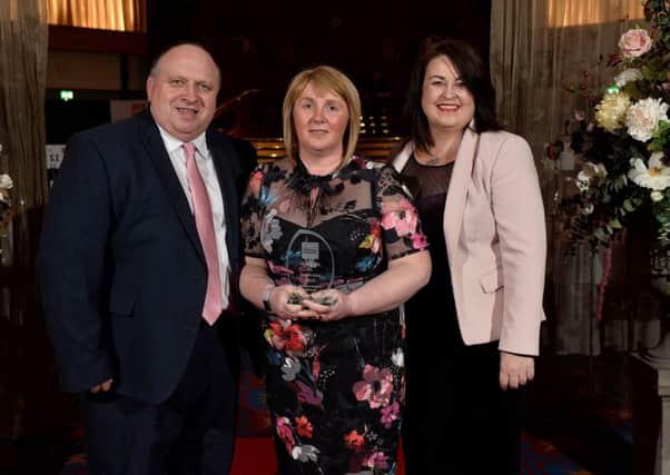Heather and Adrian Watson, foster carers with Barnardos in Northern Ireland for the last eight years, are presented with the Excellence in Foster Care award at The Fostering Networks annual Northern Ireland Foster Care Awards.