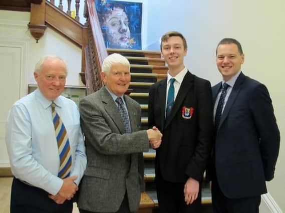 Pictured are Mr T Shields (Rotary), Mr L Boyd (Rotary), Joseph Garvey and Mr R S McLoughlin (Principal)