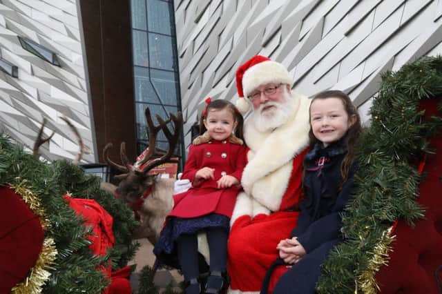 Caitlin and Frankie-Rose Canavan with Father Christmas at Titanic Belfast.