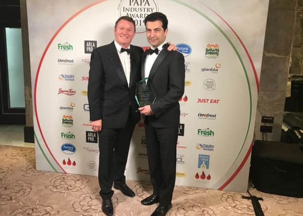 Theo Randell, Michelin-starred TV celebrity chef presents the award to Boris Farani