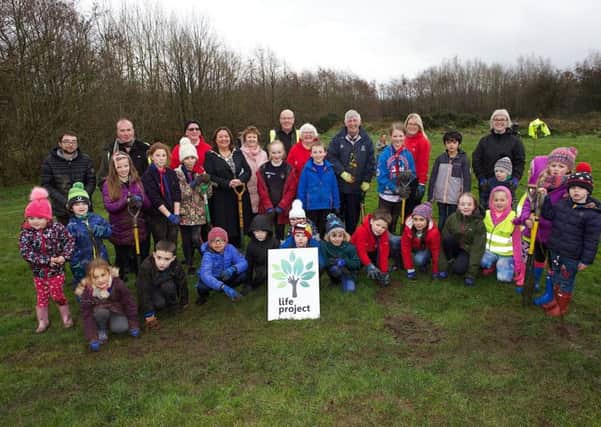 Mayor of Derry City and Strabane District Council, Councillor Michaela Boyle, with St. Eugene's Cubs and Beavers taking part in the Tree Planting event at the Top of the Hill Park on Corrody Road. Included are Paul McSwiggan, Environmental Health Officer, DCSDC, and Michael Savage, Derry City & Strabane District Council. (Photo - Tom Heaney, nwpresspics)