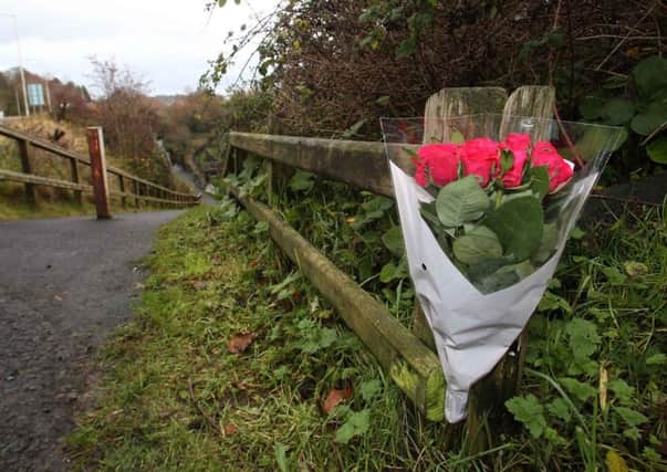 Flowers were left along the river in Larne after the tragic accident