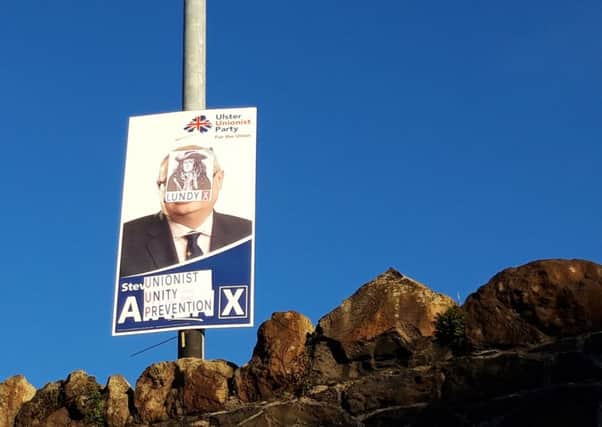 A defaced UUP poster in the Victoria Road area of Larne.
