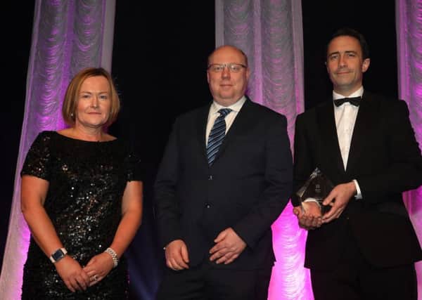 Peter McVerry, U105 (category sponsor) presents the Exporter of the Year Award to Helen Boyd and Mark McQuillan of Nicobrand
