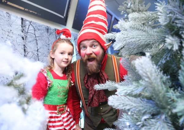 Olivia Hamill with a elf at the North Coast Post Office