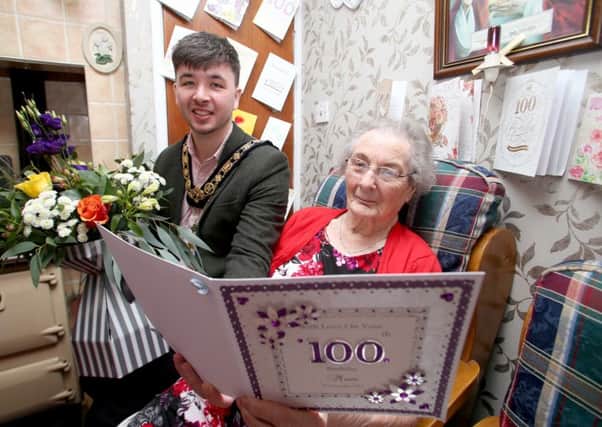 Mayor of Causeway Coast and Glens Borough Council congratulates Margaret Gillan on her 100th birthday at her home in Armoy