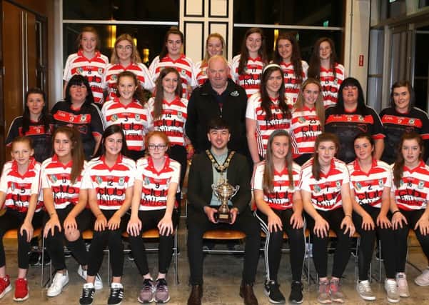 The Mayor of Causeway Coast and Glens Borough Council Councillor Sean Bateson pictured with some of those who attended a recent reception in Cloonavin for members of Ballerin GAA club's Under 16 girls football team and Under 14 and Under 16 camogie teams to mark their recent successes