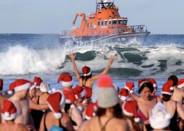 Pictured during the Portrush Lifeboat Santa Spalsh at East Strand Portrush .PICTURE KEVIN MCAULEY/MCAULEY MULTIMEDIA