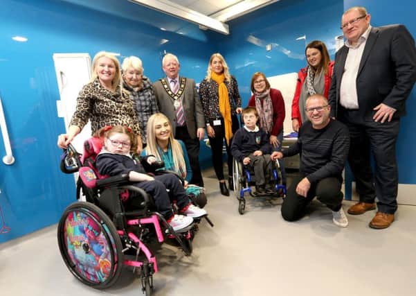 Mayor of Antrim and Newtownabbey, Alderman John Smyth is joined by Councillor Leah Smyth, Councillor Paul Dunlop and Councillor Neil Kelly to officially open the new Changing Places facility at Antrim Forum with local residents
