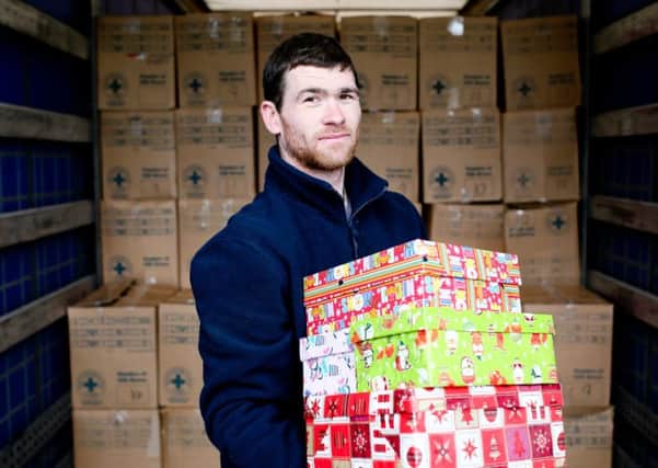 Daniel Horner, a member of Blythswood Irelands logistical team, packing just some of the 14,700 shoe boxes providing much-need aid for deprived communities in Ukraine and Moldova.