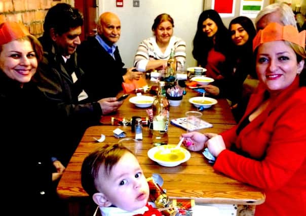 Some of the people enjoying a free Christmas dinner at Common Grounds Cafe, south Belfast, in 2015.