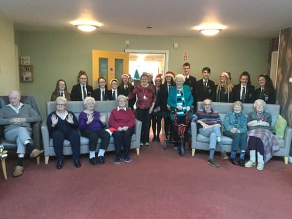 New-Bridge Chamber Choir pictured with the residents of Spelga Mews