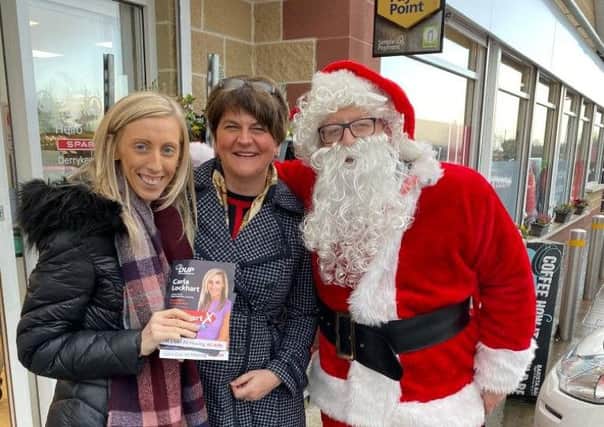 Carla and DUP leader Arlene Foster pictured with Santa