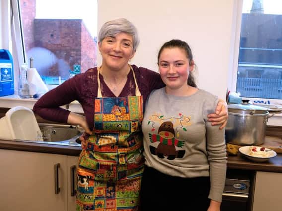 Gillian McKee and Emily Boomer make sure everyone enjoys the Whitehead community Christmas Day dinner in the Methodist Church Hall.