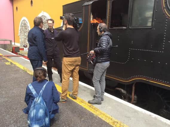A French TV crew carries out an interview with Whitehead-based volunteer Chris Ragg during a servicing stop at Killarney on the 2018 Two-Day tour.