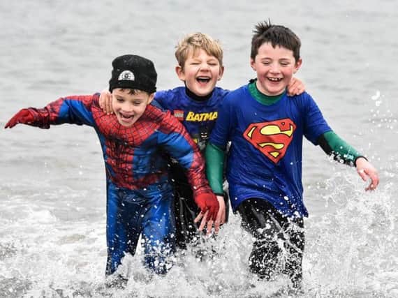 Making a splash at the New Year's Day dip in Islandmagee.  Photos courtesy of Bill Guiller
