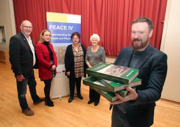 Representatives from Carey Historical Society, Kevin McGowan and Aidan McMichael, with Councillor Cara McShane, Causeway Coast and Glens Borough Council's Museum Services Development Manager Helen Perry and Vice Chair Peace IV Partnership Patricia Crossley pictured at the recent launch of the new book, 'Placenames and Fieldnames of Culfeightrin'