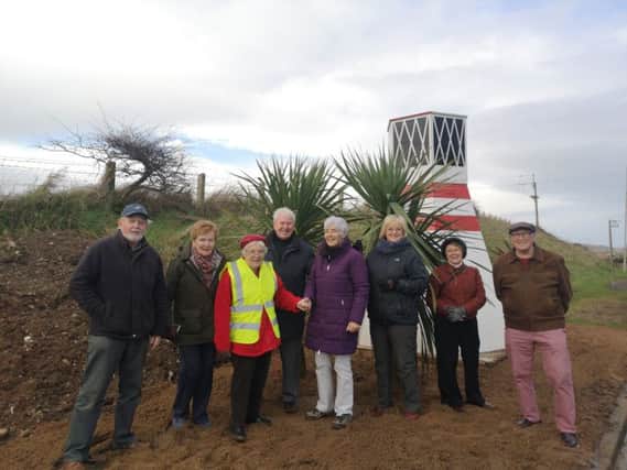 Volunteers from Brighter Whitehead are delighted with the new lighthouse.