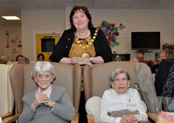 The Mayor of Mid and East Antrim, Cllr Maureen Morrow, paid a visit to Knockagh Rise Nursing Home for the 100th birthday celebrations of May McCracken (left) and Ivy Scott. INCT 04-002-PSB
