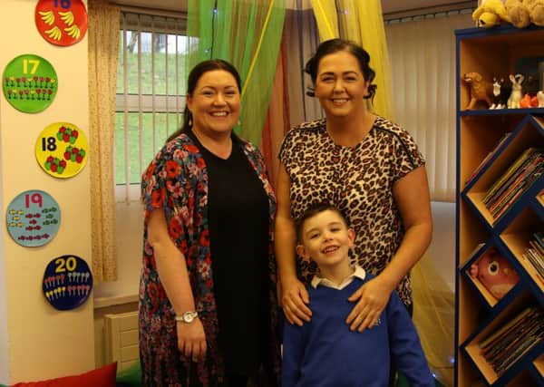 Caolan O'Neill with his mum Amanda and St Paul's Primary School teacher MIss Fox