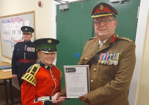 Cadet LCpl Hamilton receives her National Praiseworthy First Aid Award from Colonel Paul Shepherd, Colonel Cadets 38 Brigade.