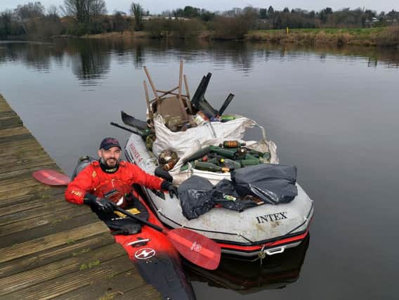 Jon Medlow with some of the rubbish he has collected on the River Bann