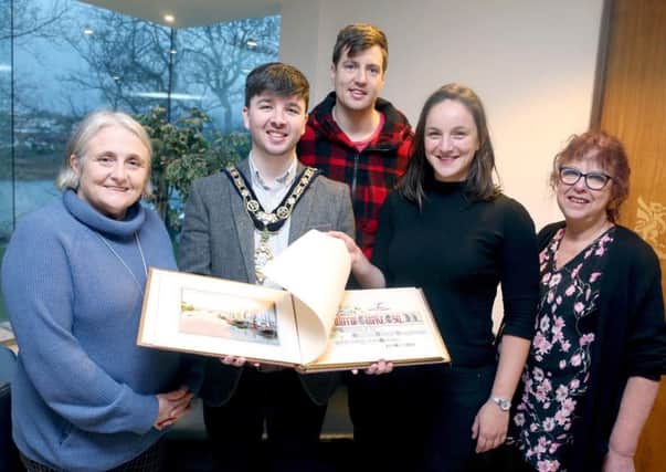The Mayor of Causeway Coast and Glens Borough Council Councillor Sean Bateson recently received the illuminated address book at an event held in Cloonavin. Included in the picture are Sue McLaughlin, Connie Kelly and Causeway Coast and Glens Borough Council's Museum Services Development Manager Helen Perry. The book is now set to go on display in Coleraine Museum