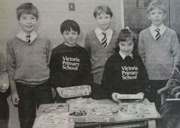 Teacher Mrs Alison Neilly pictured with Victoria Primary School pupils who organised a variety sale in aid of Children in Need.
1991