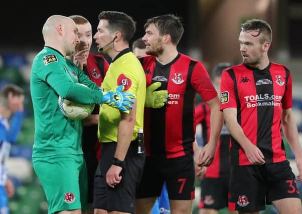 Crusaders players appeal against the decision by referee Ian McNabb to award Coleraine a penalty kick. Pic by Pacemaker.