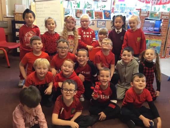 Pupils dressed in red to raise funds and awareness for the Children's Heartbeat Trust.