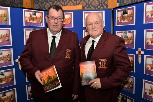 Paul Duffin (left) secretary of the Larne & District Great War Society and Alan Rice, chairman, at the launch of 'A Bigger Goal To Score' about footballers from the Larne area who served in the First World War. INLT 08-003-PSB