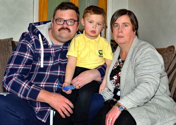 Edenderry Primary School Special Unit pupil, Ryan Calvert (4) who was left on a school bus alone for a number of hours pictured with his parents John and Gillian. INPT09-207.